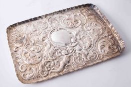 Victorian Sheffield silver dressing table tray with embossed decoration showing putti, a female