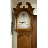 A 20th century pine longcase clock with painted dial (modern).