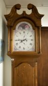 A 20th century pine longcase clock with painted dial (modern).