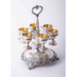 Victorian silver plated breakfast egg cup stand with removable egg cups with round baluster base