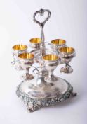 Victorian silver plated breakfast egg cup stand with removable egg cups with round baluster base