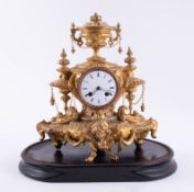 A 19th Century French gilt clock, with bell strike, height 32cm, on wood plinth, with key and