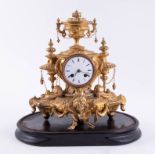 A 19th Century French gilt clock, with bell strike, height 32cm, on wood plinth, with key and