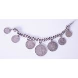 An Antique coin bracelet set with six coins including Victorian gothic florin, a 1787 George III