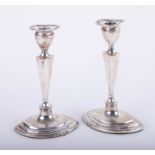 A pair Geo V Adam style silver candlesticks, height 23cm.