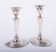 A pair Geo V Adam style silver candlesticks, height 23cm.