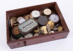 A drawer of various pocket watches and parts.