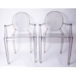 A pair of clear Louis Ghost Armchairs by Kartell.