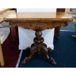 A Victorian walnut fold over card table on pedestal base, width 94cm.