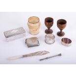An alabaster cup, Treen egg cups, silver vesta with monogram, hardstone pillbox, a silver propelling