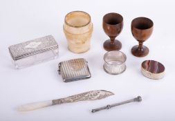 An alabaster cup, Treen egg cups, silver vesta with monogram, hardstone pillbox, a silver propelling