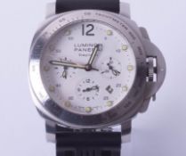 A replica fashion watch marked 'Luminor Panerai', cased (watch has faults).