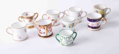 Royal Crown Derby miniature tyg, loving cups, two mugs, Royal Worcester tyg and three others (9).