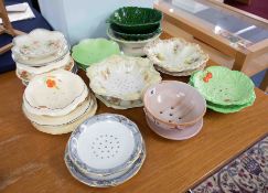 A collection of Victorian and later strainer dishes including Carlton Ware (approximately 13).