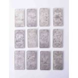 A Chinese Animal Year Maio calendar set (12 in white metal each approx. 10cm x 5cm).