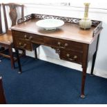 A writing table with fret work gallery.