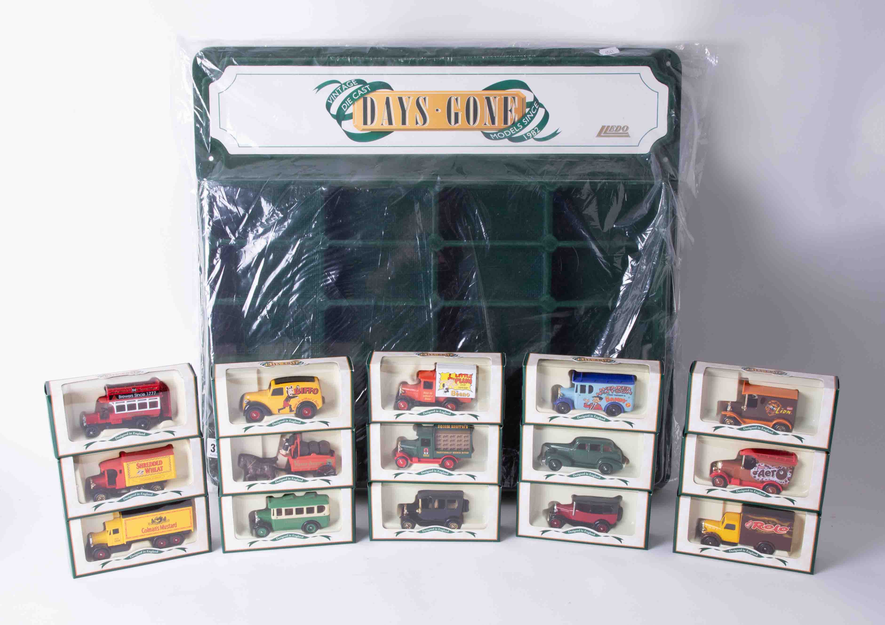 Days Gone Lledo, an as new display stand together with five boxed sets of three diecast models.