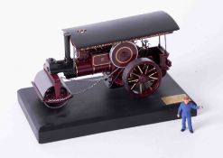 A Bassett Lowke precision scale white metal model of a traction steam roller, on stand, length 17cm,