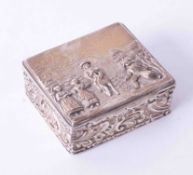 A George V silver & gilt square box, decorated in relief with figures in a landscape on the lid