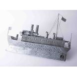 A tin model of a Great War battleship, length 65cm.