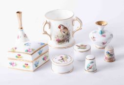 A Royal Worcester tyg with bird design, 6cm together with other miniature porcelain including