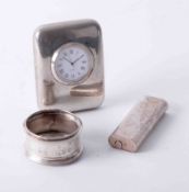 Cartier, Paris lighter 101062, silver napkin ring and travel clock (3).