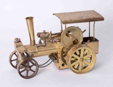 A brass model of a steam traction engine, length 30cm.