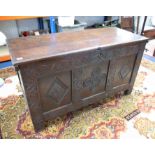 An 18th Century carved oak coffer.