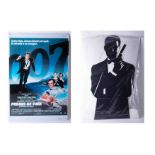 A James Bond full height cut out cardboard figure together with a Timothy Dalton tin sign (Licence