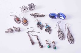 A bag of mixed silver and other earrings, costume jewellery, etc., together with a pair of silver