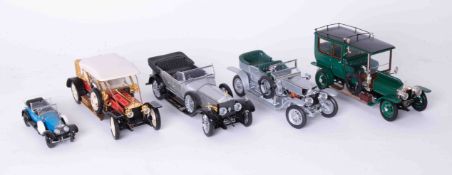 Franklin Mint five scale models comprising four Rolls Royce Silver Ghosts and a smaller model with