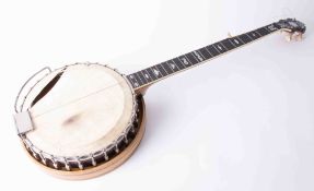 A Paragon five string Banjo, with engraved pearl headstock and fingerboard, length 94cm (damage)