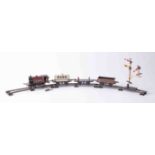 Hornby, a tin plate clockwork O Gauge train set, with LMS loco and three wagons with track, key