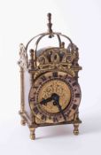 A Smiths reproduction miniature bijoux lantern clock with key, height 18cm.