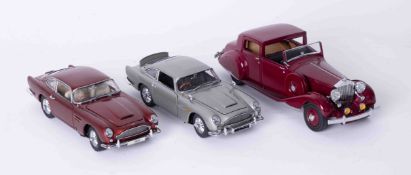 Two Danbury Mint Aston Martin DB5 boxed as new, together with 1938 Rolls Royce Phantom, all with