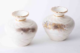 A Royal Chinaworks Worcester squat ivory vases with gilt bird decoration, height 12cm.