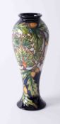 A Moorcroft, a Philip Gibson vase decorated with acorns, number 10/150 2003, height 29cm.