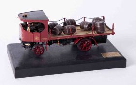 A Bassett Lowke precision scale white metal model of a flatbed Brewery Lorry, on stand, length 16cm,