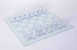 A modern glass chess set, boxed.