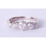 An 18ct white gold diamond five stone ring, total diamond weight approx. 1.75 carats, size S.