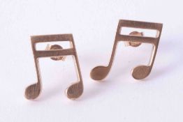 A pair of 9ct yellow gold musical note stud earrings, 2.8g.