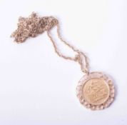 A 1915 George V half sovereign 1915 set in an ornate pendant mount and chain, total weight 12.9g.