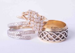 Three rings including a 14ct yellow & white gold Celtic band with spinning centre finger size Q, a