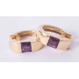 A pair of 18ct yellow gold hoop earring set square cut amethysts, 8.1g.