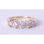 An 18ct yellow gold claw set diamond five stone ring approx. 1.25 carats (total weight), finger size