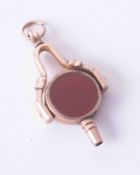 A 10ct rose gold watch key fob set bloodstone, 5.1g.