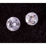 Two loose round brilliant cut diamonds, colour G to H and SI2 to P1 clarity, 1 x 3.7mm and 1 x 3.5mm