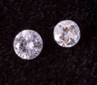 Two loose round brilliant cut diamonds, colour G to H and SI2 to P1 clarity, 1 x 3.7mm and 1 x 3.5mm