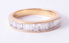An 18ct yellow gold half eternity ring set with a mixture of baguette cut & round brilliant cut