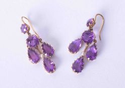 A pair of antique gold and amethyst & seed pearl set filigree style drop earrings.